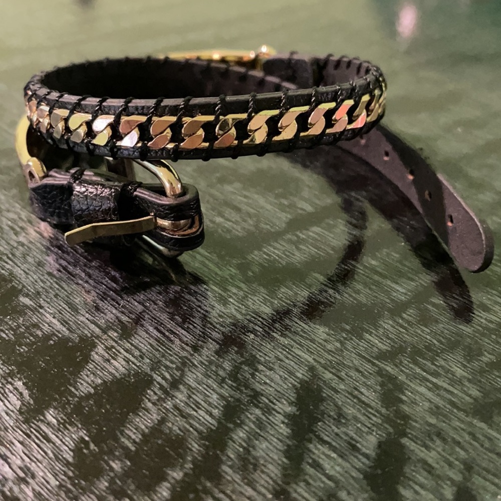 Black leather and gold bracelet